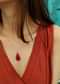 Pearl Necklace With A Red Stone Drop Pendant In The Centre