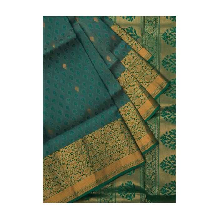 Peocock saree in silk beautified in weaved embroidery only on Kalki