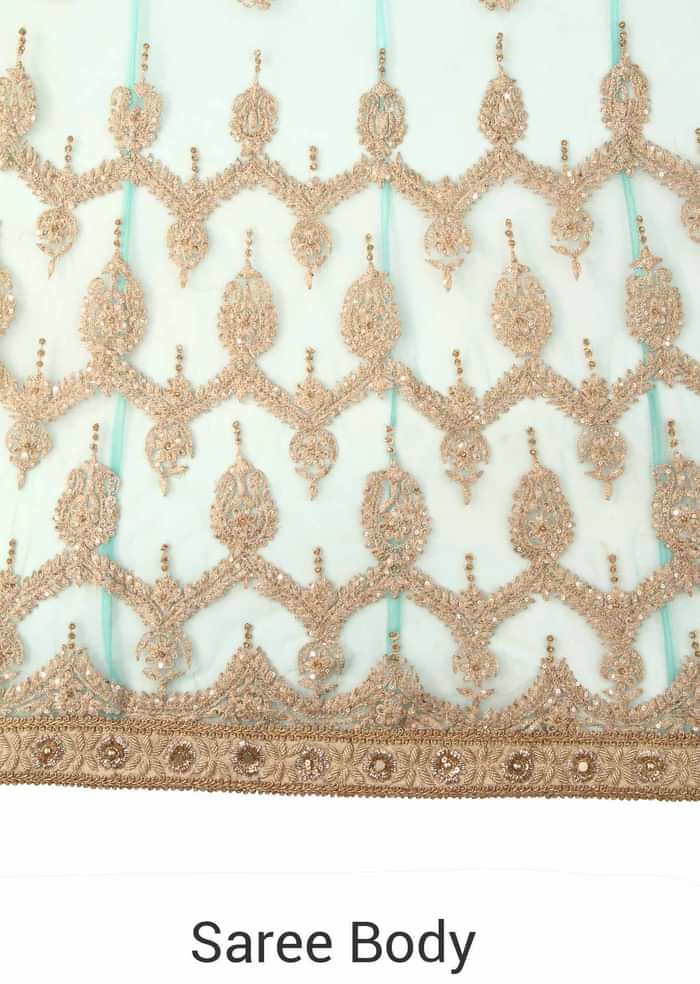 Pink and green lehenga saree enhanced in embroidered butti only on Kalki