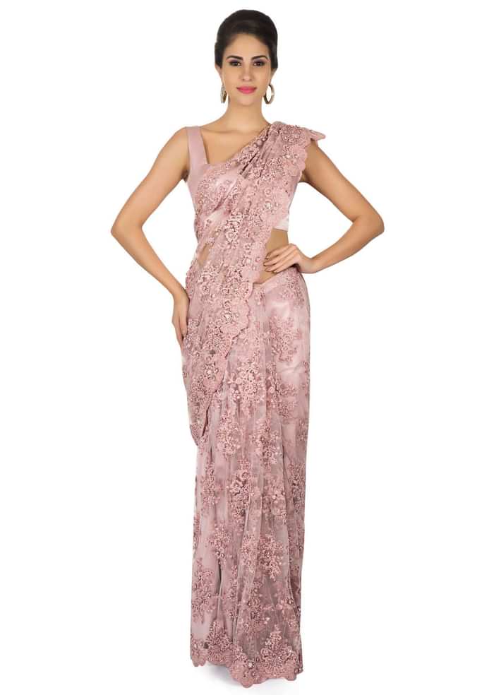 Pink embroidered net saree with scalloped border only on Kalki