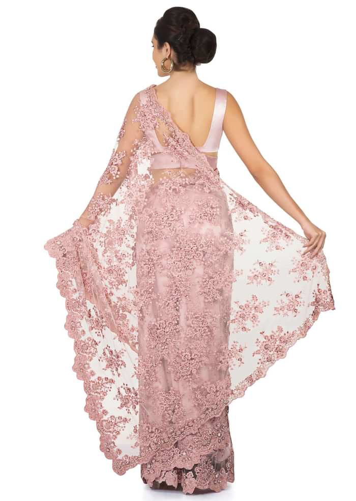 Pink embroidered net saree with scalloped border only on Kalki
