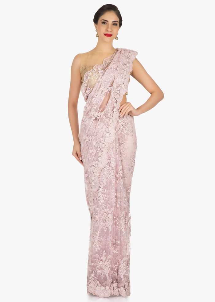 Pink saree in embroidered net encrusted in floral motifs with resham and moti work only on Kalki