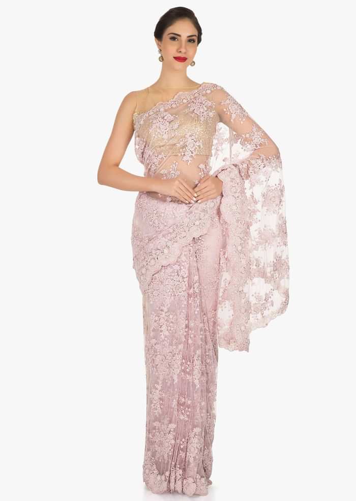 Pink saree in embroidered net encrusted in floral motifs with resham and moti work only on Kalki
