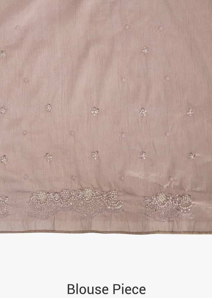 Pink saree in embroidered net encrusted in floral motifs with resham and moti work only on Kalki