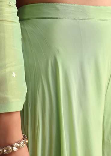 Embrace elegance with our Green Embroidered Tissue Crop Top And Palazzo Suit