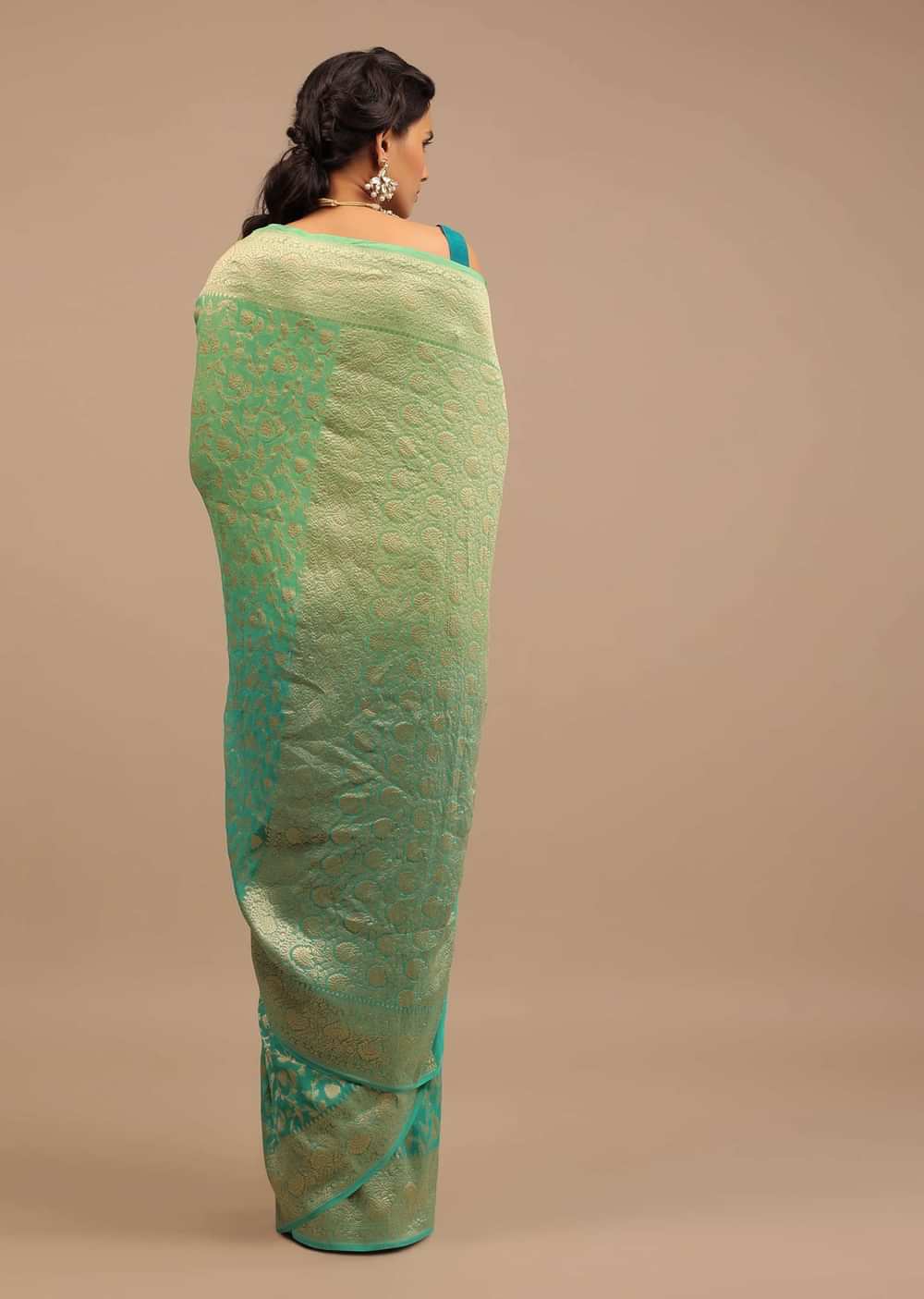 Jade Green Saree Made In Georgette And Beautified With Golden Jaal In A Floral Pattern