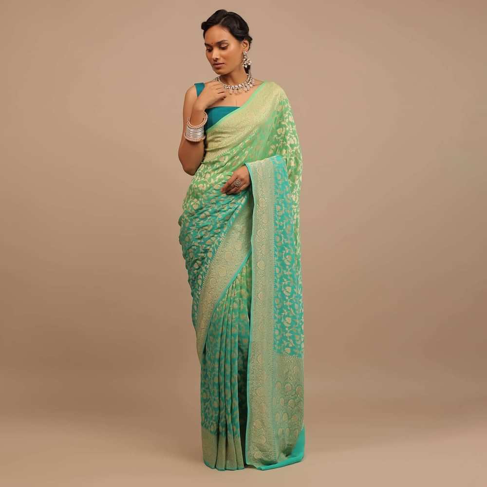 Jade Green Saree Made In Georgette And Beautified With Golden Jaal In A Floral Pattern