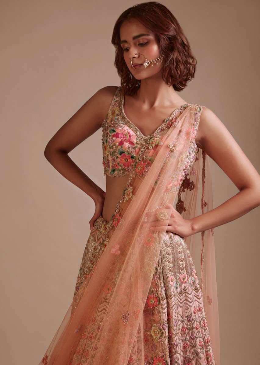 Powder Pink Lehenga Choli In Raw Silk With Colorful Resham And Sequins Embroidered Geometric And Floral Motifs