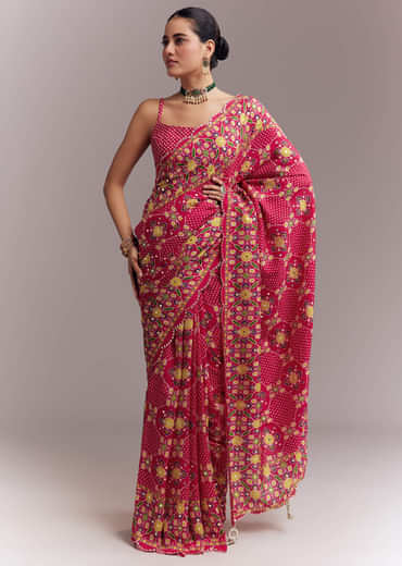 Rani Pink Satin Saree With Handwoven Ikat Print And Mirror Work Rani Pink Satin Saree With Handwoven Ikat Print And Mirror Work