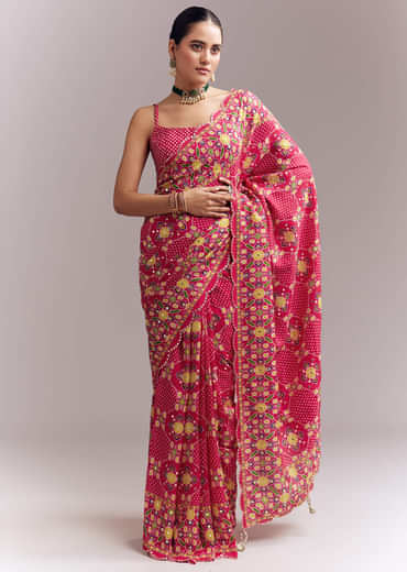 Rani Pink Satin Saree With Handwoven Ikat Print And Mirror Work Rani Pink Satin Saree With Handwoven Ikat Print And Mirror Work