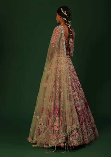 Rani Pink Lehenga Choli In Raw Silk With Heavy Embroidered Kalis Using Colorful Resham And Cut Dana In Floral Motifs Online - Kalki Fashion