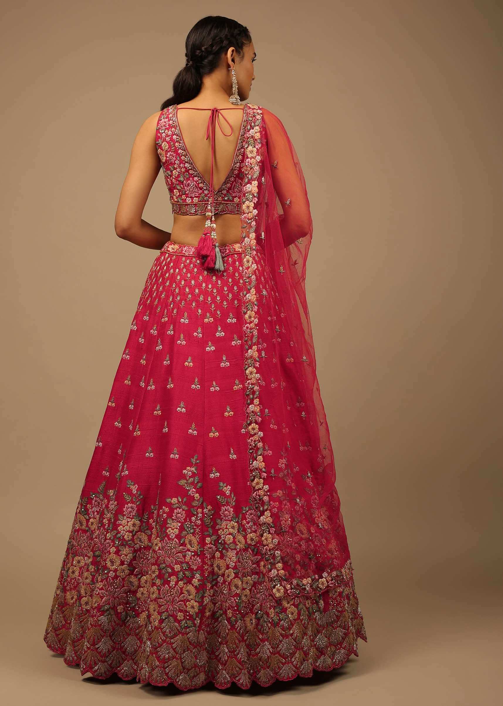 Rani Pink Lehenga Choli In Raw Silk With A Cluster Of Multi Colored Resham Flowers And Cut Dana Highlights