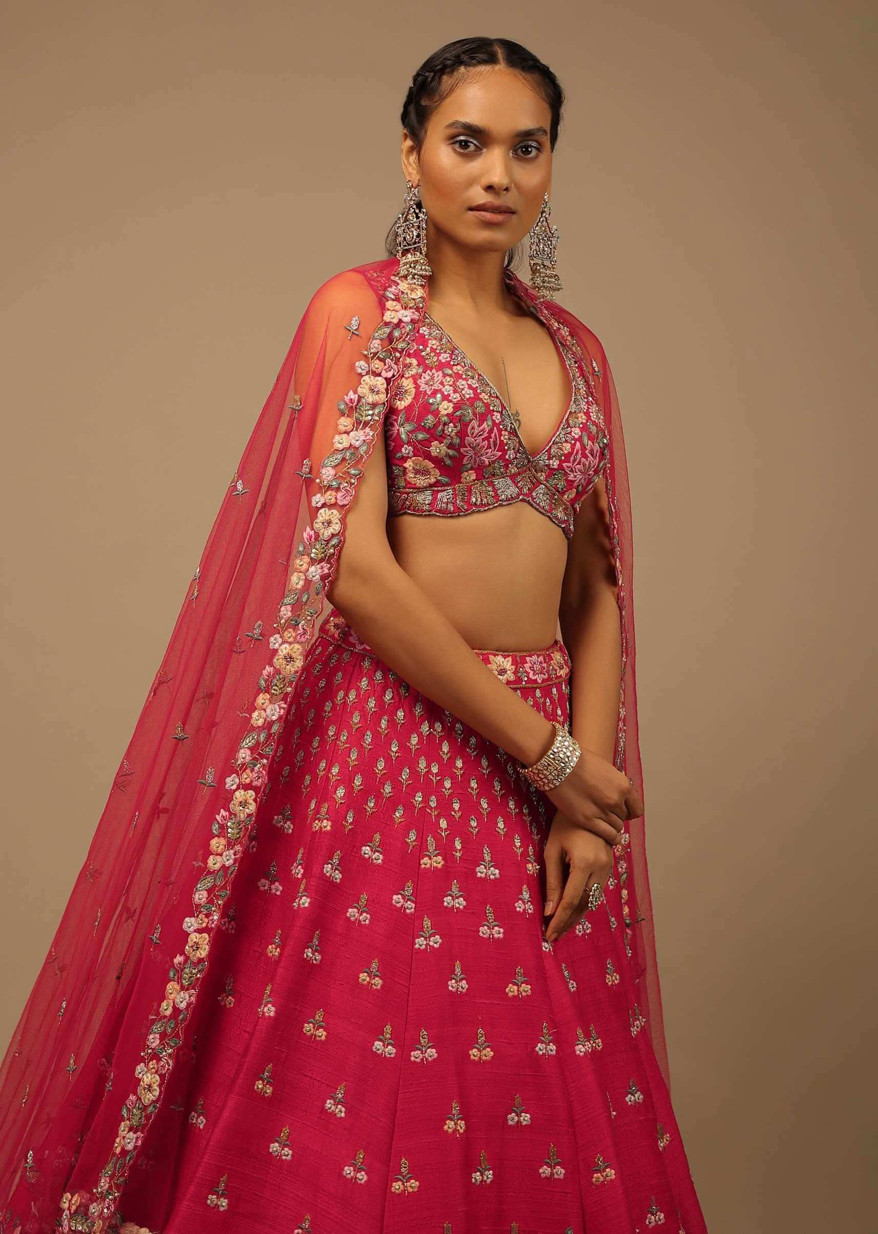 Rani Pink Lehenga Choli In Raw Silk With A Cluster Of Multi Colored Resham Flowers And Cut Dana Highlights