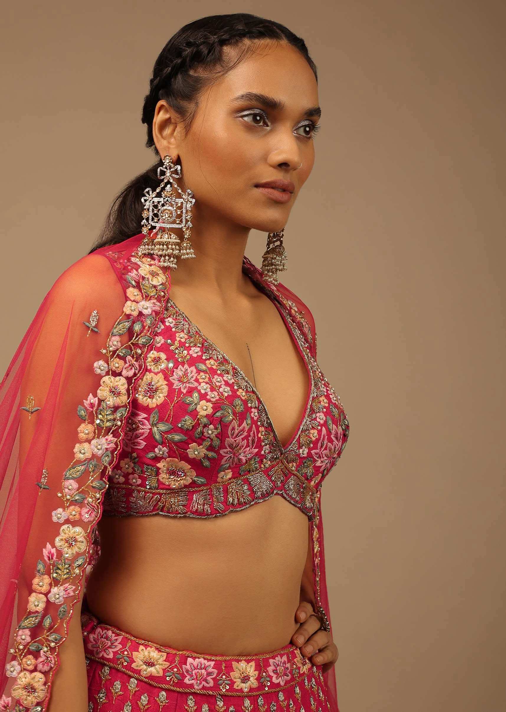 Rani Pink Lehenga Choli In Raw Silk With A Cluster Of Multi Colored Resham Flowers And Cut Dana Highlights