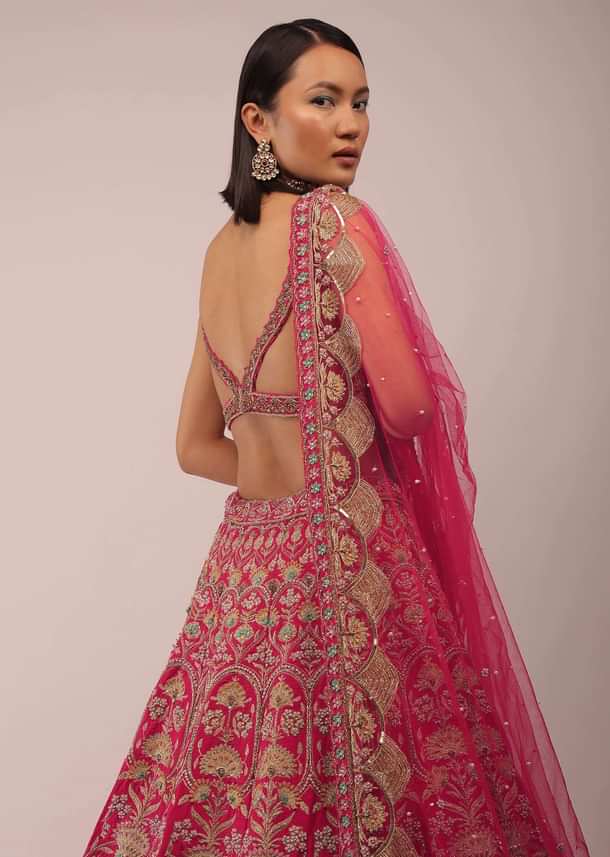 Rani Pink Lehenga In Golden Zari Work Embroidery Inspired By Mughal Architecture With Matching Net Dupatta In Embroidered Buttis