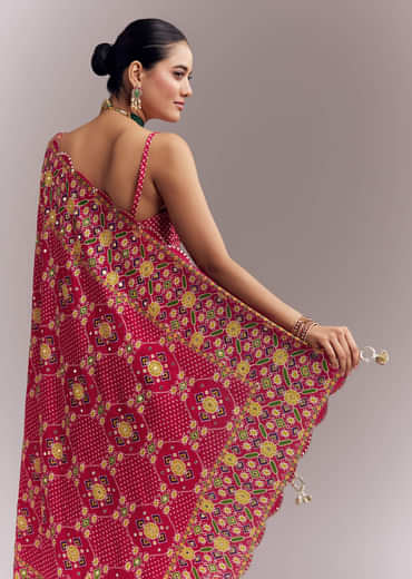 Rani Pink Satin Saree With Handwoven Ikat Print And Mirror Work Rani Pink Satin Saree With Handwoven Ikat Print And Mirror Work