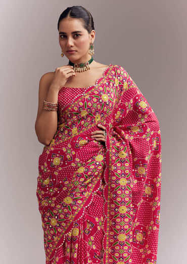 Rani Pink Satin Saree With Handwoven Ikat Print And Mirror Work Rani Pink Satin Saree With Handwoven Ikat Print And Mirror Work