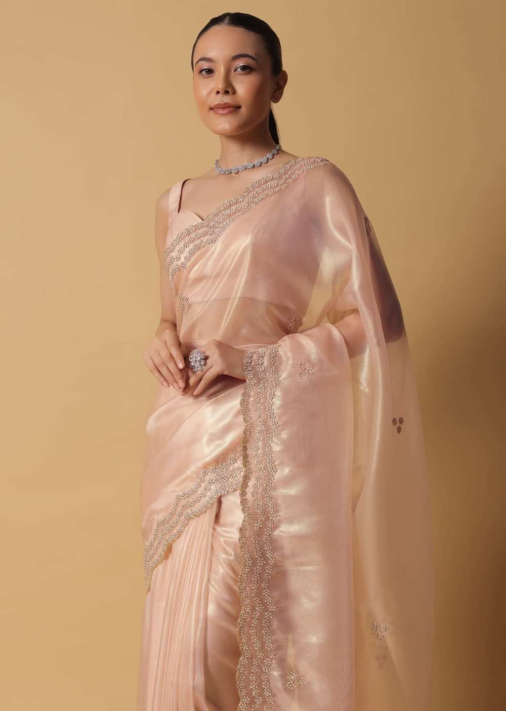 Rose Gold Toned Foil Saree In Tissue With Cut Dana Embroidered Borders