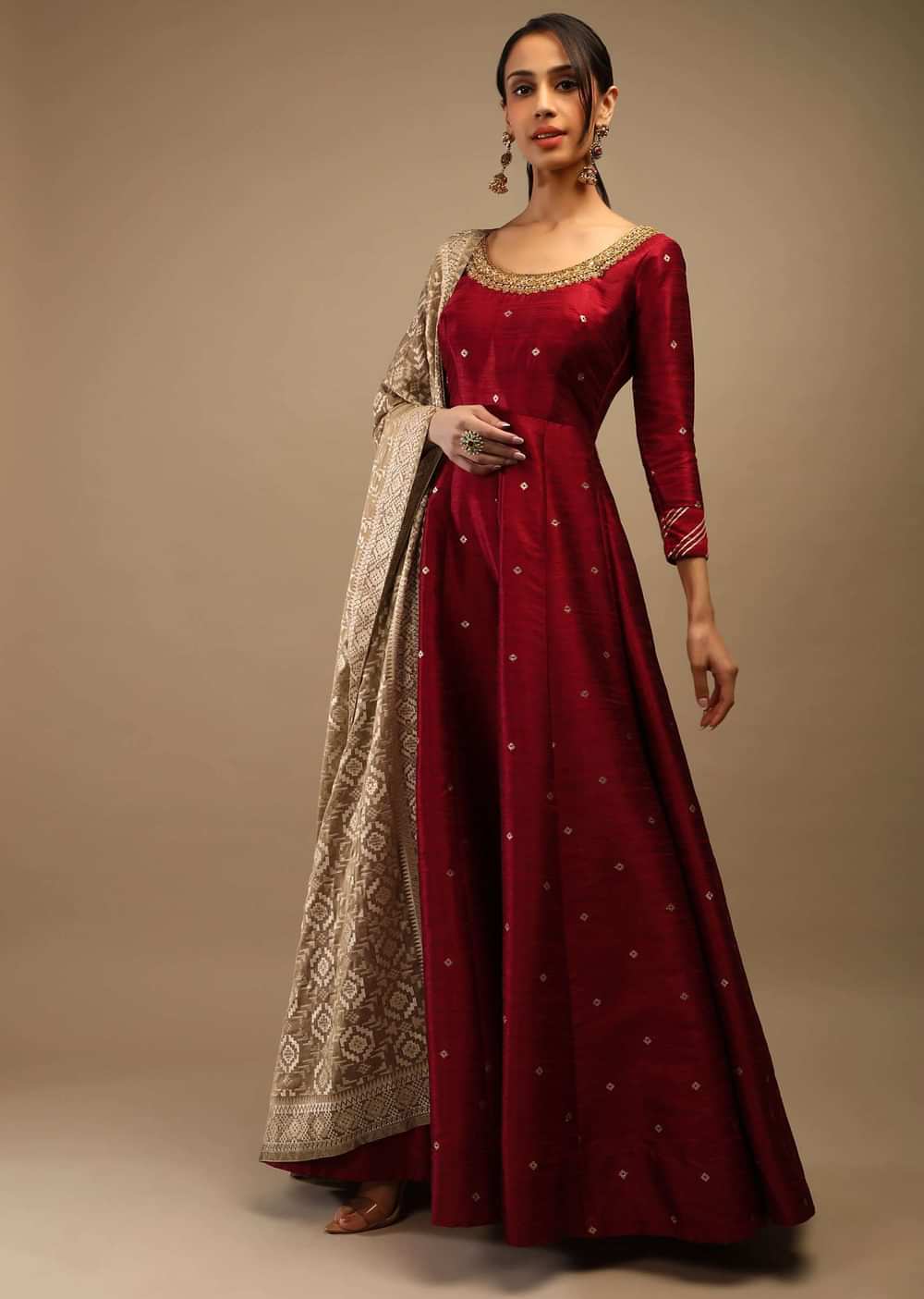 Ruby Wine Anarkali Suit In Raw Silk With Brocade Buttis, Zardosi Embroidered Neckline And Contrasting Gold Brocade Dupatta