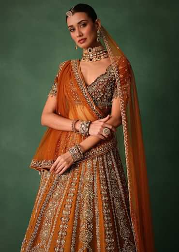 Rust Embroidered Bridal Lehenga With Deep Neckline Blouse And Dupatta