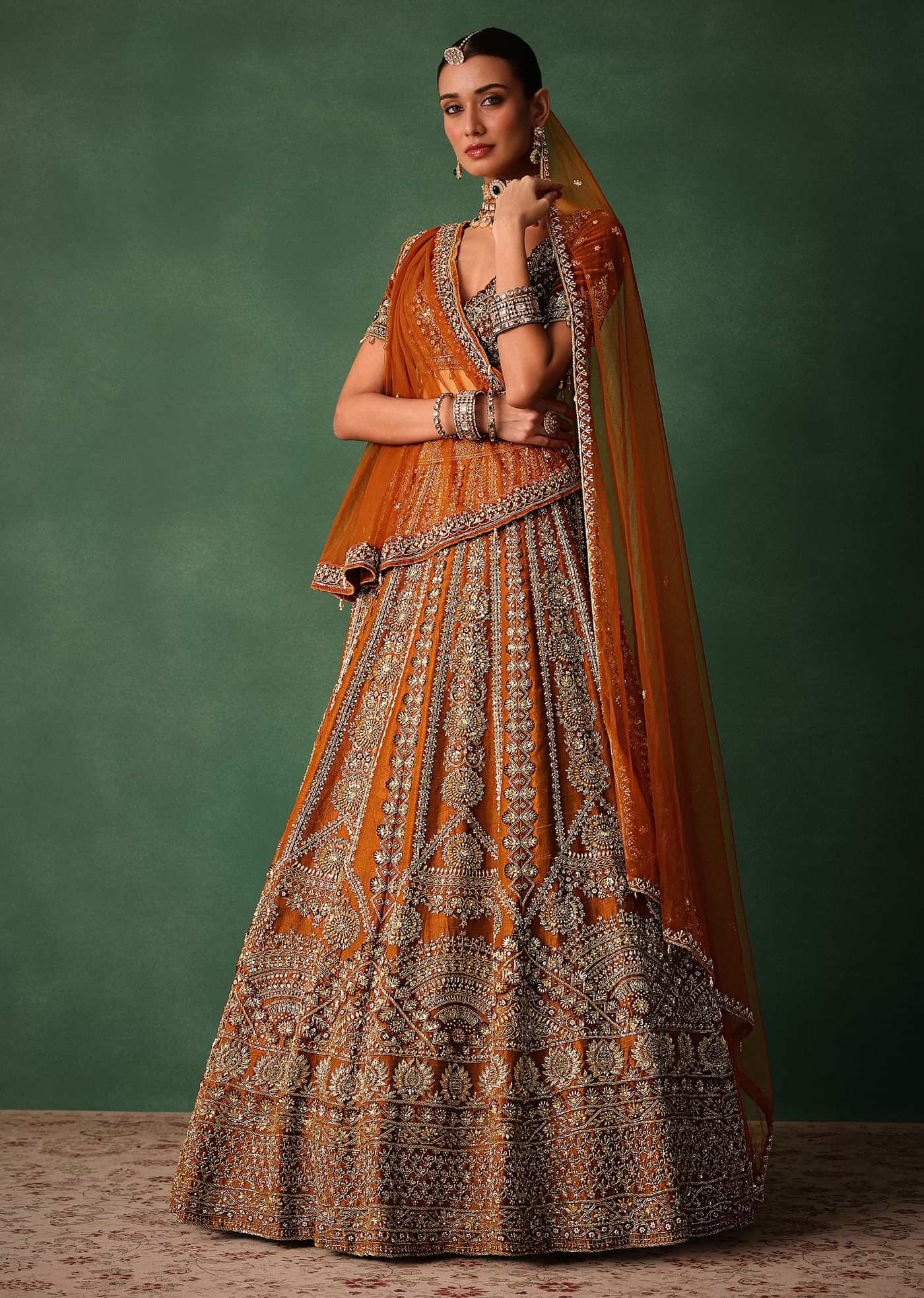 Rust Embroidered Bridal Lehenga With Deep Neckline Blouse And Dupatta