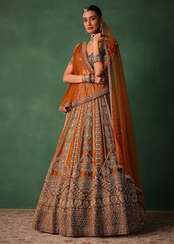 Rust Embroidered Bridal Lehenga With Deep Neckline Blouse And Dupatta