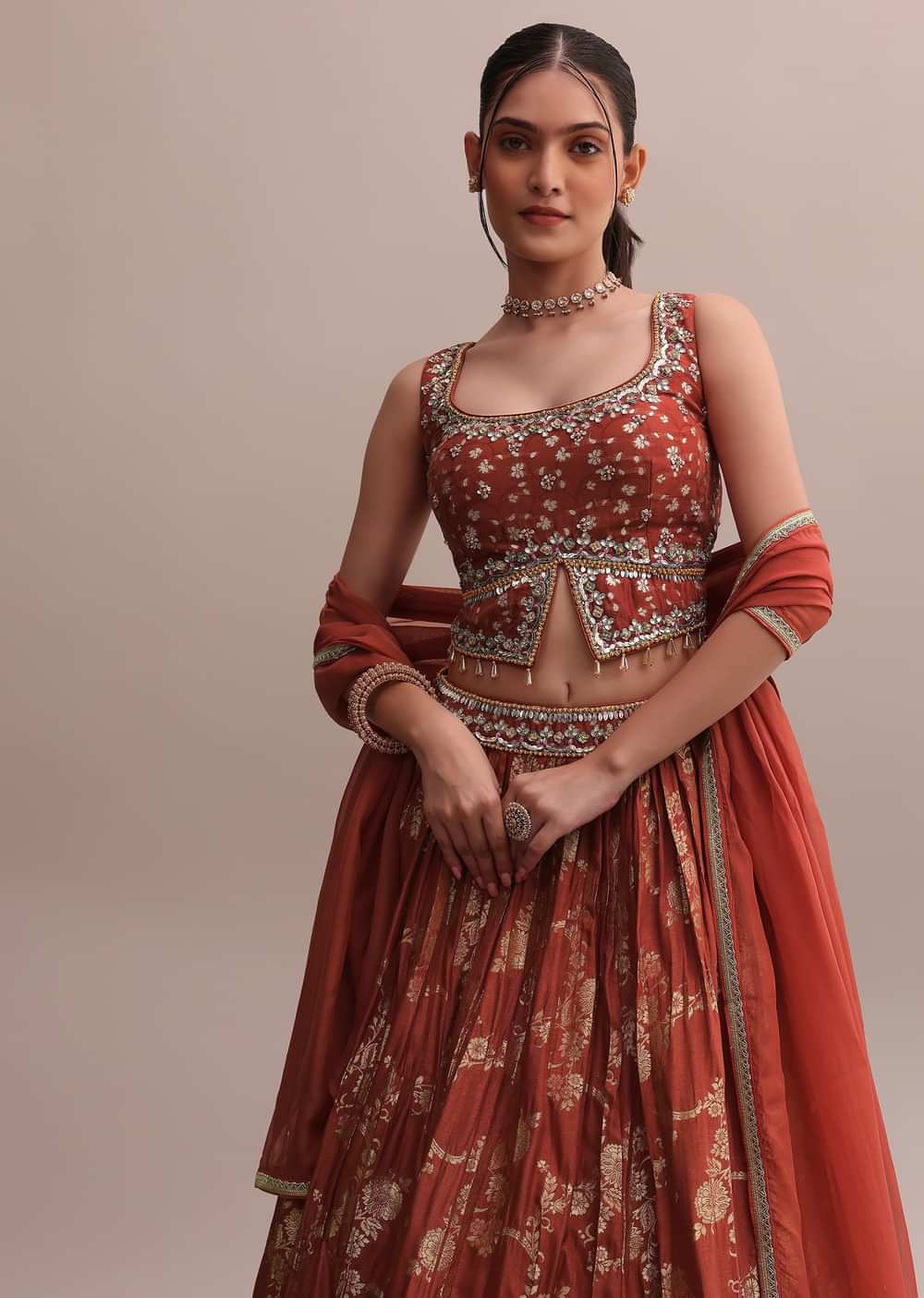 Rusty Orange Banarasi Silk Printed Lehenga With Slit Cut Choli And Dupatta