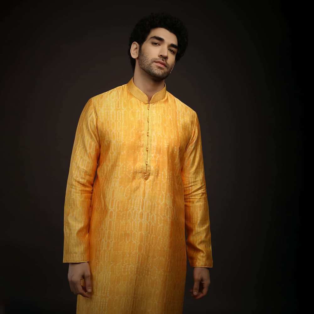 Saffron Yellow Kurta Set In Raw Silk With Tie Dye Design All Over And Resham Work On The Placket