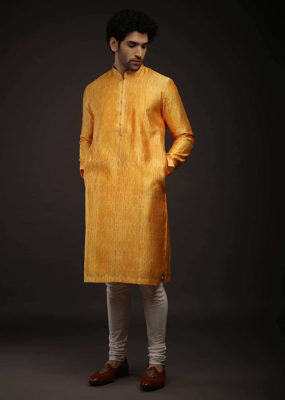Saffron Yellow Kurta Set In Raw Silk With Tie Dye Design All Over And Resham Work On The Placket