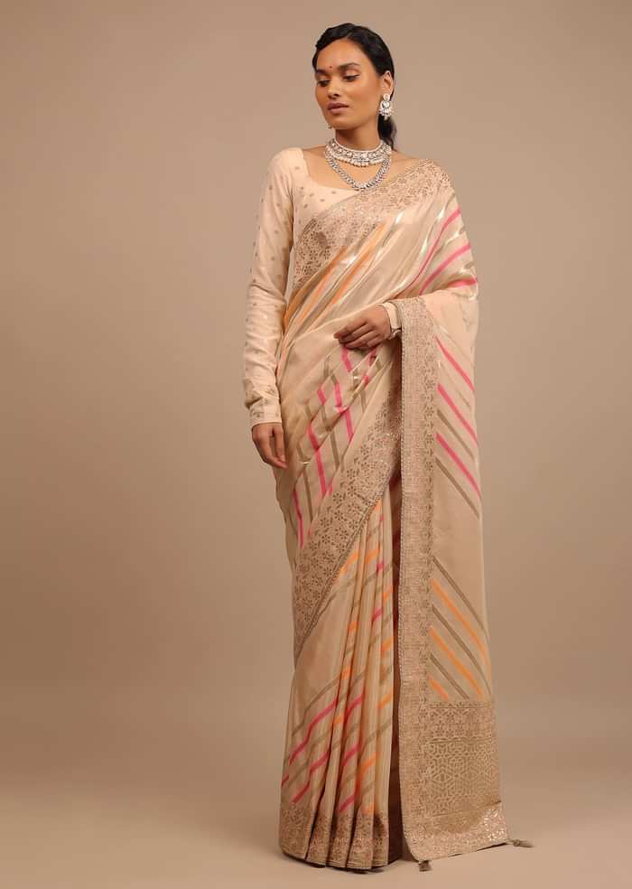 Cream Saree In Dola Silk With Multi Colored Woven Diagonal Stripes And Floral Border