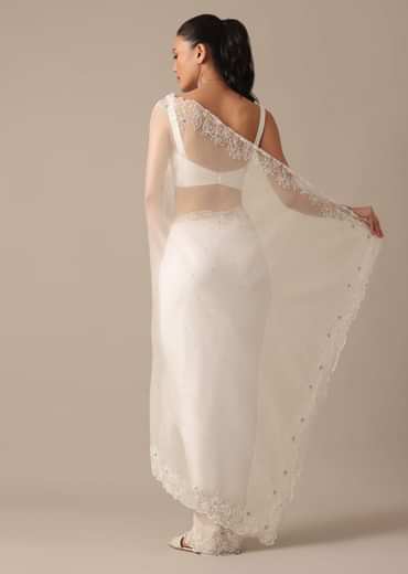 White Organza Saree With Cutdana Work And Unstitched Blouse Piece