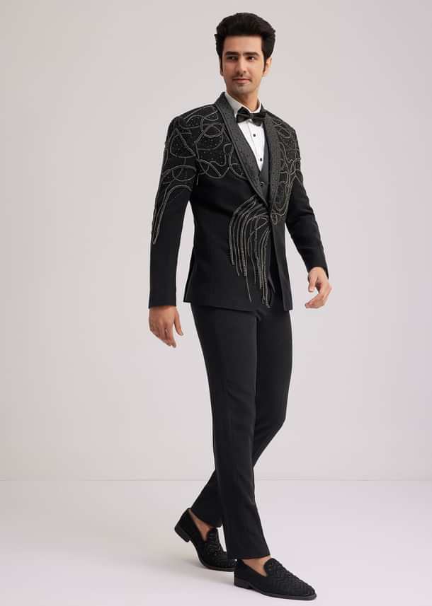 Black Suiting Tuxedo With Metallic Chain And Stone Work