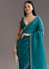 Teal Blue Crushed Tissue Stone Embellished Saree With Cutdana Scallop Border