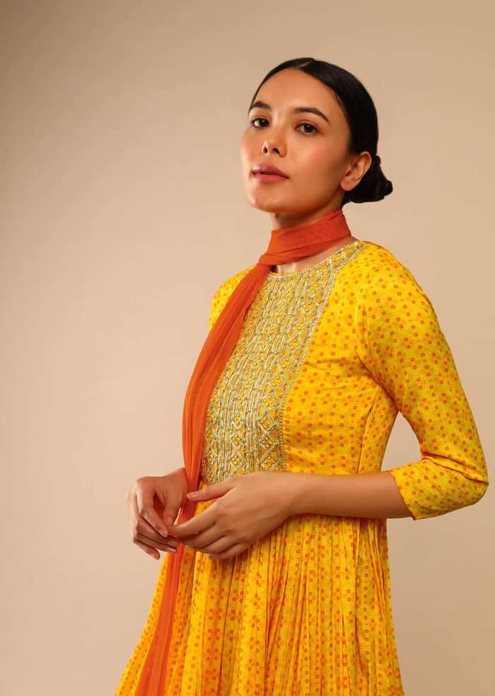 Honey Yellow Sharara Suit In Crepe With Bandhani And Lehariya Print Paired With Moti Embroidered Peplum Kurti