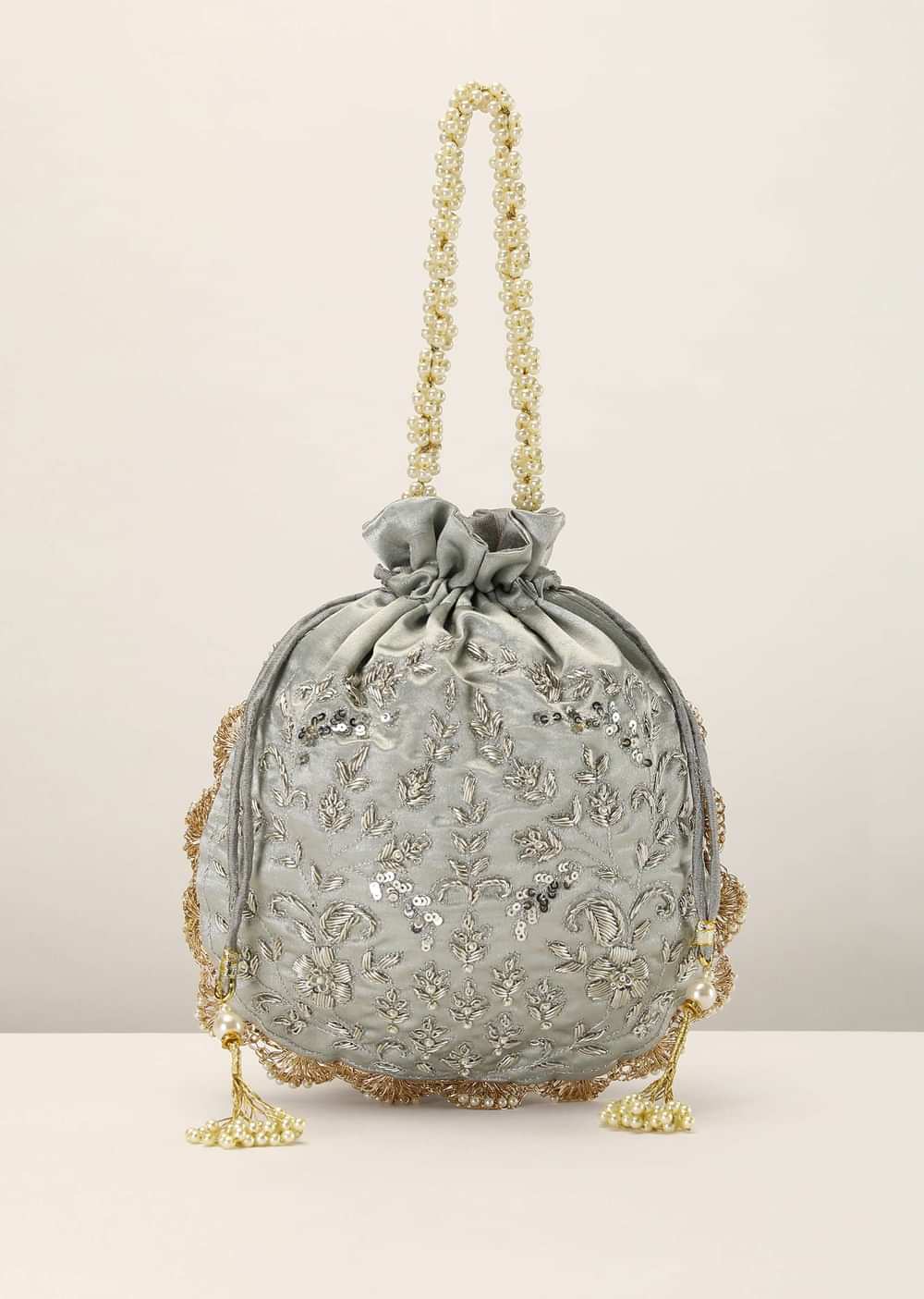 Silver Grey Potli In Satin Silk With Hand Embroidery Detailing Using Zardosi Work In Floral Design All Over