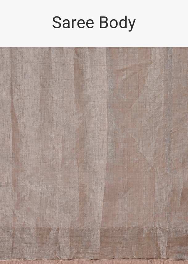 Silver Zari Tissue Saree With Embroidered Emerald Green Stitched Blouse