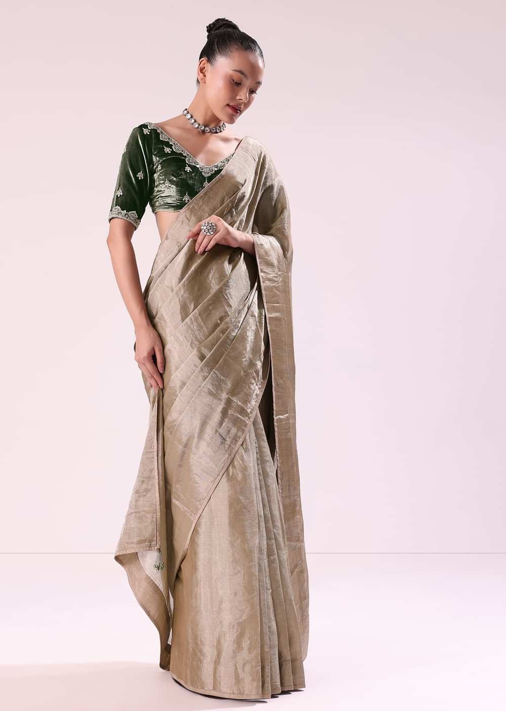 Silver Zari Tissue Saree With Embroidered Emerald Green Stitched Blouse