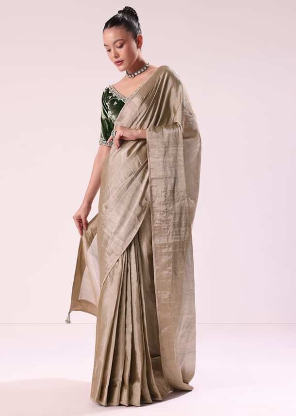 Silver Zari Tissue Saree With Embroidered Emerald Green Stitched Blouse