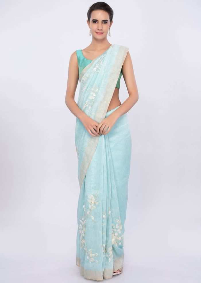 Sky blue linen saree in sequins and cut dana embroidery only on Kalki