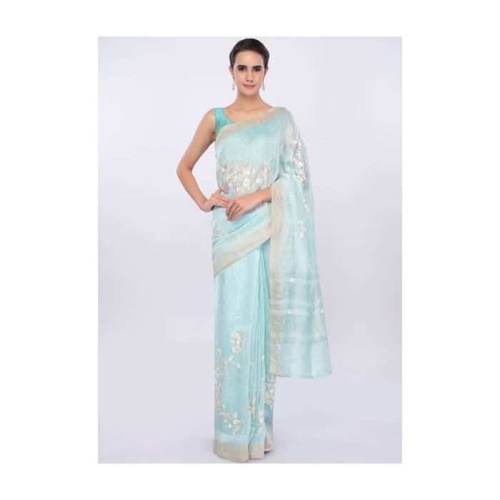 Sky blue linen saree in sequins and cut dana embroidery only on Kalki