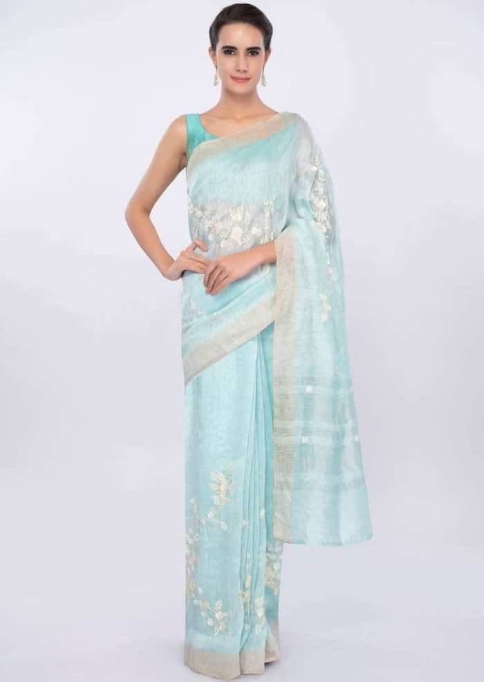 Sky blue linen saree in sequins and cut dana embroidery only on Kalki