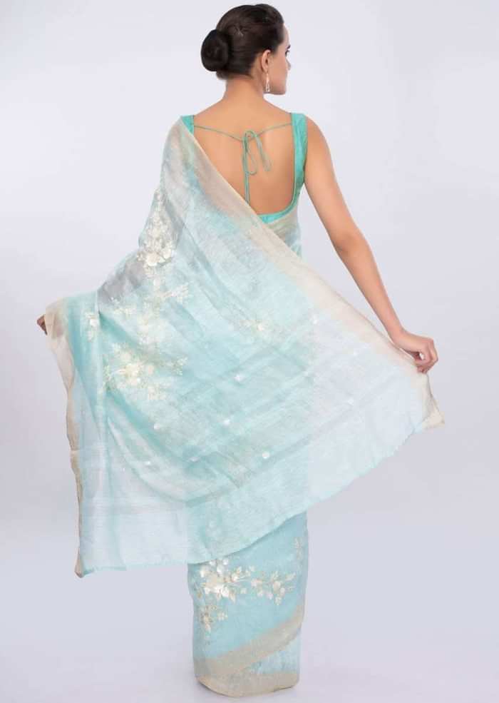 Sky blue linen saree in sequins and cut dana embroidery only on Kalki