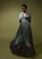 Steel Blue Gown In Satin With Floral Print And Fancy Gathered Sleeves With Adjustable Tassel Dori And Plunging Neckline
