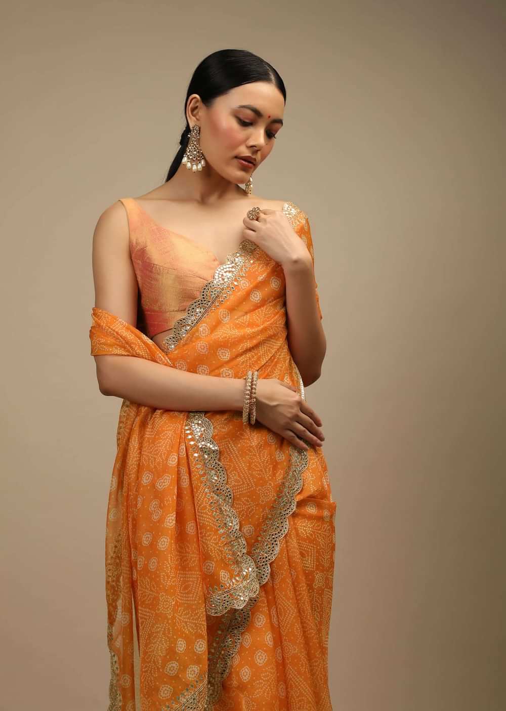 Tangerine Saree In Organza With Bandhani Buttis And Gotta Patti Embroidered Scallop Cut Border