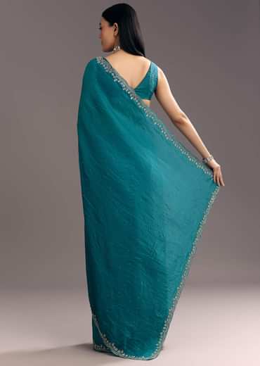 Teal Blue Crushed Tissue Stone Embellished Saree With Cutdana Scallop Border