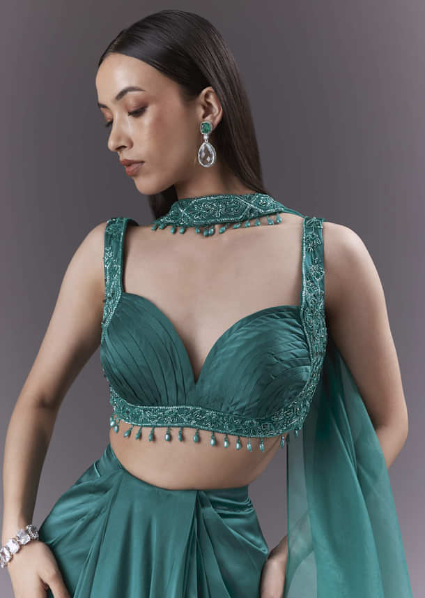 Teal Satin Crop Top And Drape Skirt Set With Heavy Embroidery