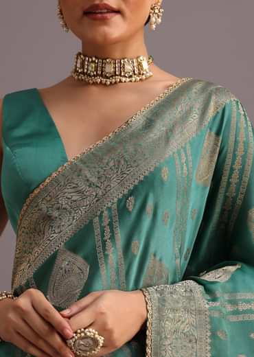 Teal Zari Work Satin Silk Woven Saree And Brocade Border