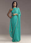 Turquoise Blue Embroidered Chinon Saree With Wavy Border