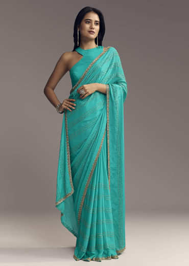 Turquoise Blue Embroidered Chinon Saree With Wavy Border
