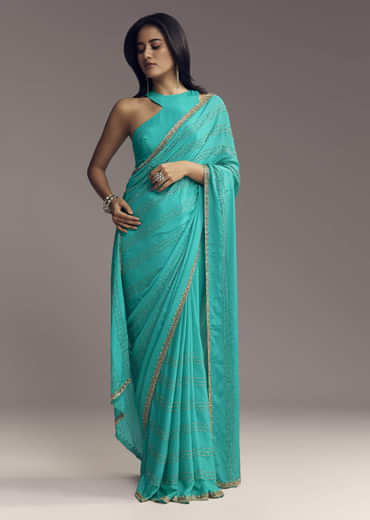 Turquoise Blue Embroidered Chinon Saree With Wavy Border